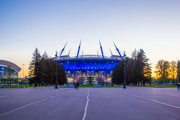 Stadium with blue lighting in the evening, at sunset, St. Petersburg, Russia night St. Petersburg, Russia - August 14, 2017: The new stadium "Zenith Arena" in evening sunset, where will be held the World Cup in 2018, Saint-Petersburg, Russia park designer label stock pictures, royalty-free photos & images