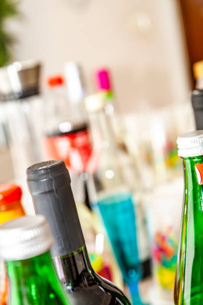 The party table is filled with bottles and cups.