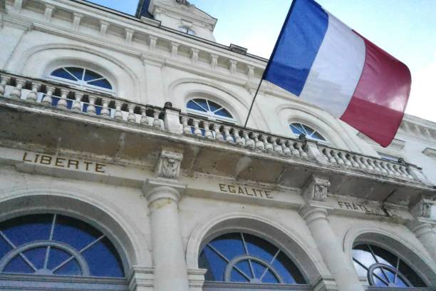 City Hall of Chatellerault in France City Hall entrance with french flag town hall government building photos stock pictures, royalty-free photos & images