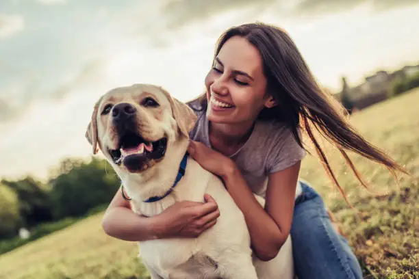 Photo of Young woman with dog