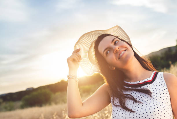 istock Young woman relaxing on beautiful meadow. 942619506