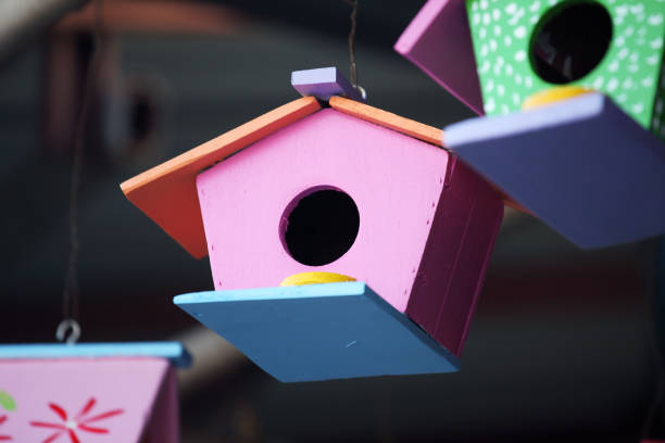 istock colorful wooden birdhouse background. 942619644