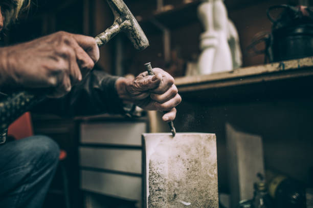 istock Unrecognizable Senior Stone cutter artist 942627022