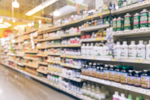 istock Blurred vitamin store shelves huge variation of vitamins and supplements 942627440