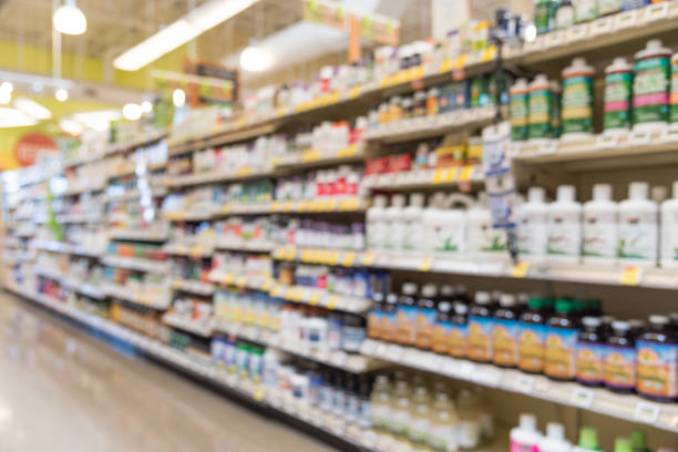 istock Blurred vitamin store shelves huge variation of vitamins and supplements 942627562