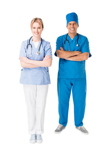 istock Doctor and nurse with arms folded isolated on white 942627730