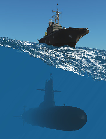 Naval submarine on open blue sea surface under cloudy sky