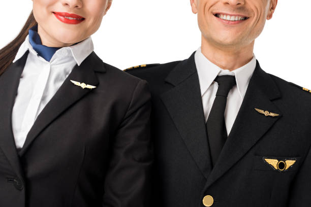 istock Close-up view of stewardess and pilot in uniform isolated on white 942628456