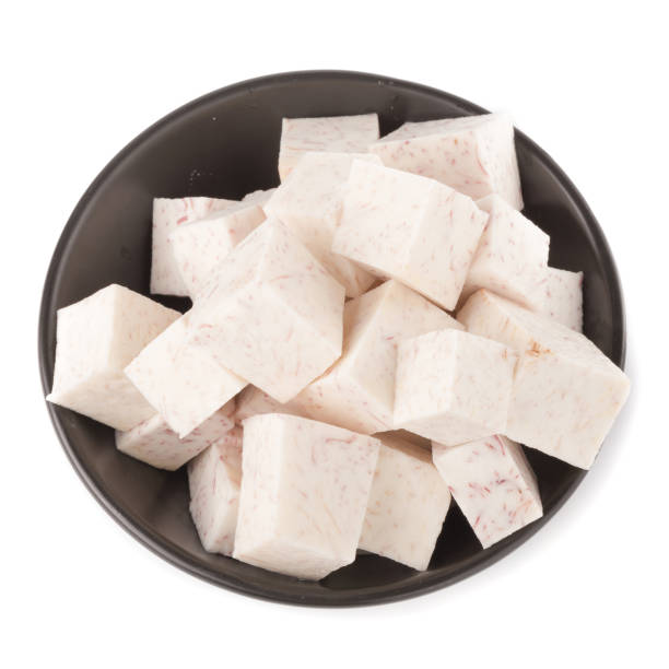 istock Black bowl of Cube taro root isolated on a white background 942632232