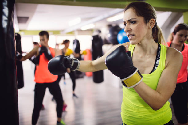 istock Women Practicing Boxing In The Gym 942635002
