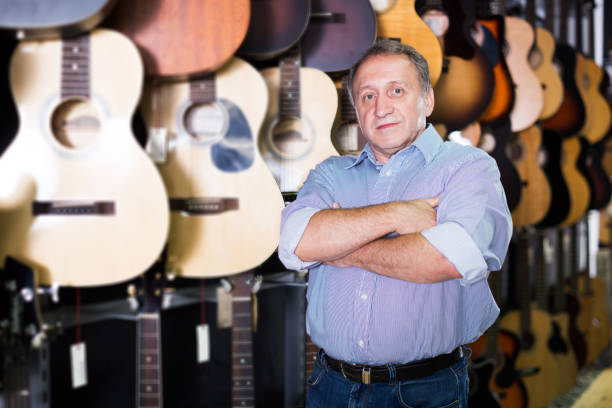istock male is standing with modern guitar 942635198