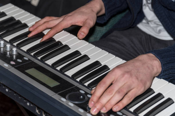 istock Hands of a pianist. Plays on the synthesizer 942639202