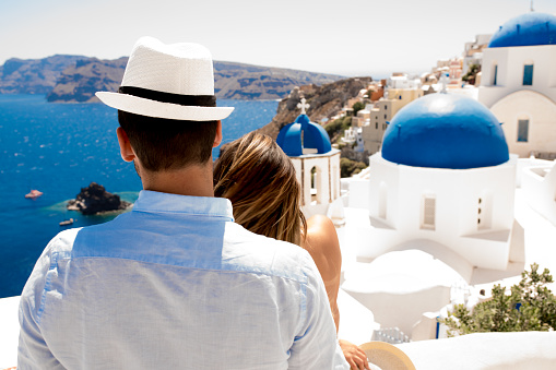 Adult Couple Looking at View From Santorini Island.