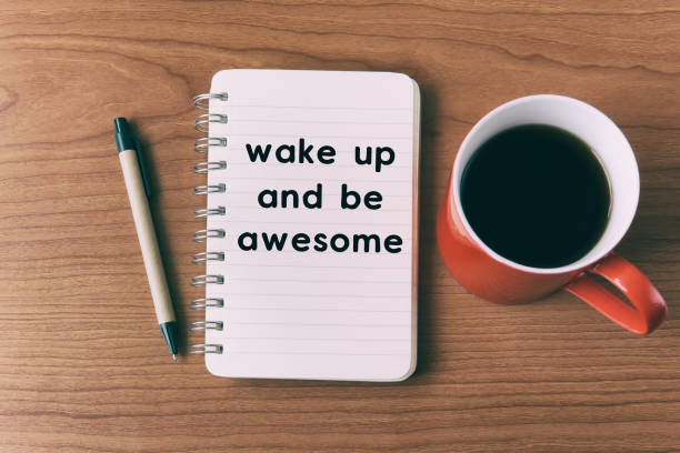 istock Inspirational quote on notepad - wake up and be awesome 942642582