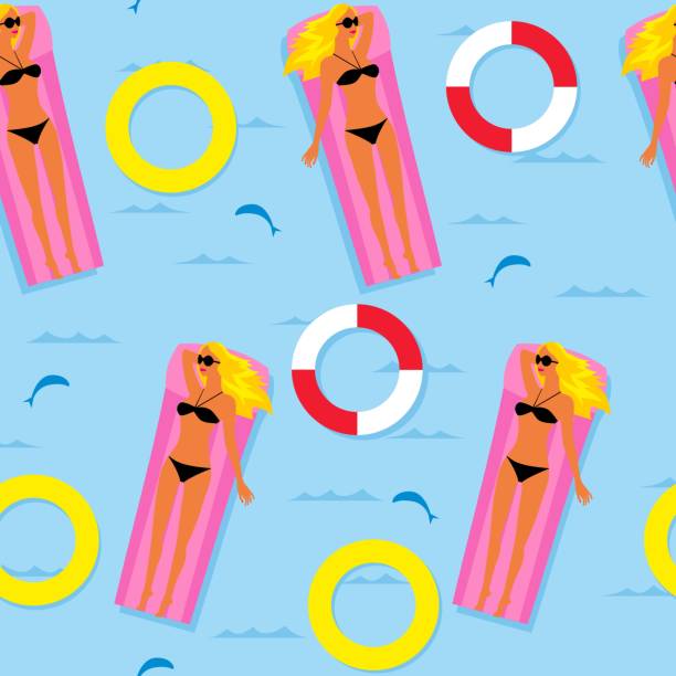 istock girl in a bikini is floating in the sea on an inflatable mattress. 942664846