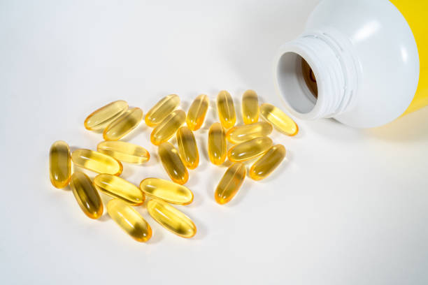istock evening primrose oil on white isolated background. 942665684