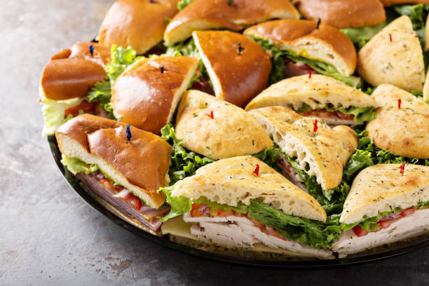 istock Tray of turkey and ham sandwiches 942666640