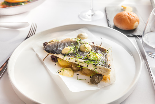 Seabass  with beautiful presentation, olive, butter,