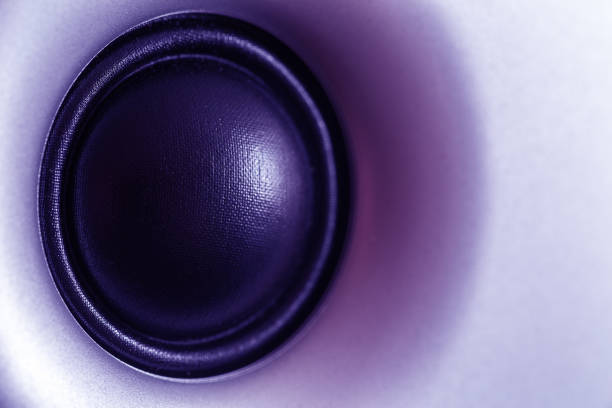 istock Ultraviolet toned audio speaker or subwoofer dynamic, abstract tech background in ultra violet 942669428