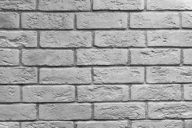 istock Abstract weathered texture stained old stucco light gray and aged paint white brick wall background in rural room, grungy rusty blocks of stonework technology color horizontal architecture wallpaper 942673508