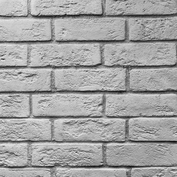 istock Abstract weathered texture stained old stucco light gray and aged paint white brick wall background in rural room, grungy rusty blocks of stonework technology color horizontal architecture wallpaper 942673546