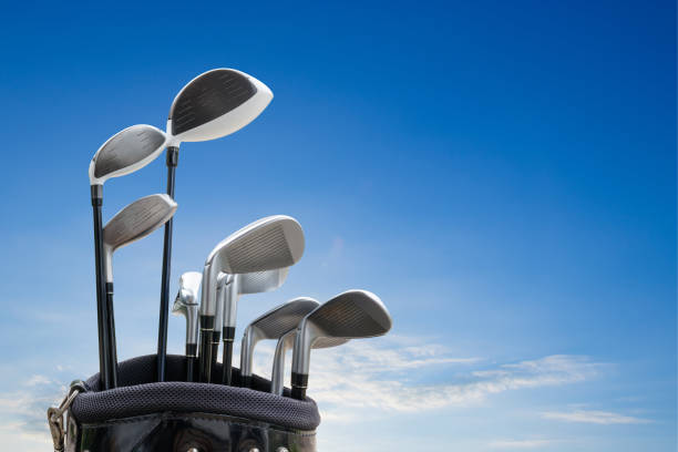 istock Golf equipment on green field background. 942682020