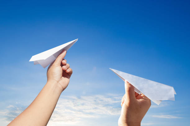 istock Hand holding rocket paper with blue sky. concept freedom. 942682042