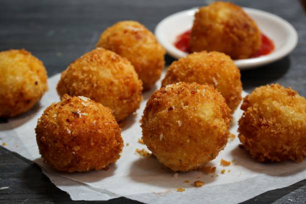 istock Potato Croquette -Bread crumbed fried food roll 942686414