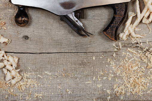 Wood Slab with Wood Shavings and Plane