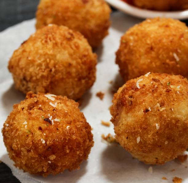 istock Potato Croquette -Bread crumbed fried food roll 942689340