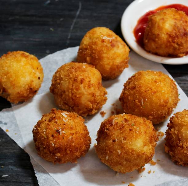 istock Potato Croquette -Bread crumbed fried food roll 942692610