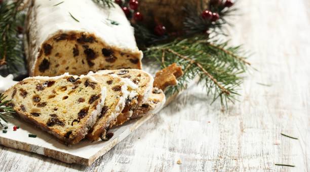 istock Christmas Stollen  on festive Xmas holiday background with copy space 942693512