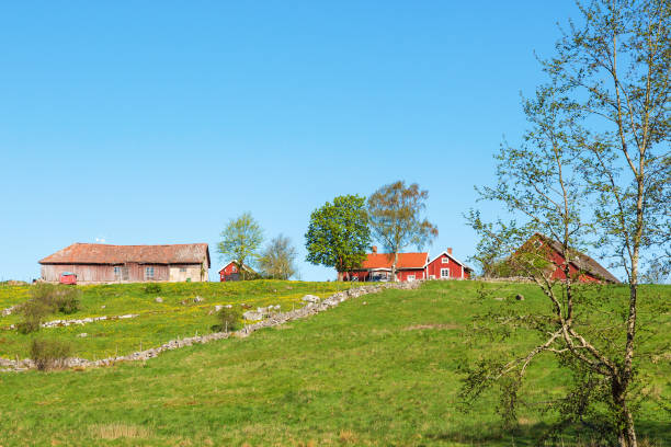 istock Old farm on a hill in the rural landscape 942696262