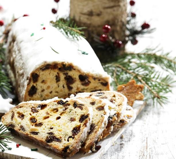 istock Christmas Stollen  on festive Xmas holiday background with copy space 942696298