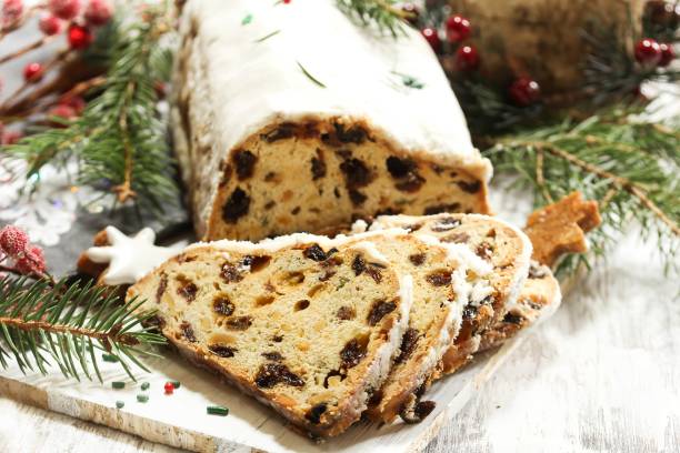 istock Christmas Stollen  on festive Xmas holiday background with copy space 942699340