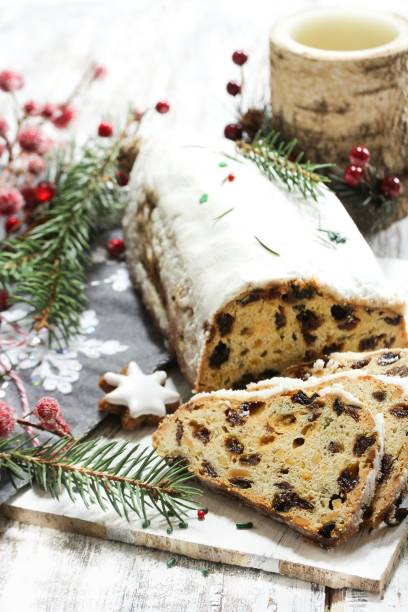 istock Christmas Stollen  on festive Xmas holiday background with copy space 942699472