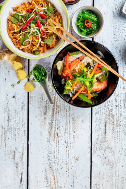istock Asian chicken and prawns curry with rice and fresh vegetable 942700144