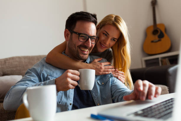 istock Happy couple relaxed at home 942700788
