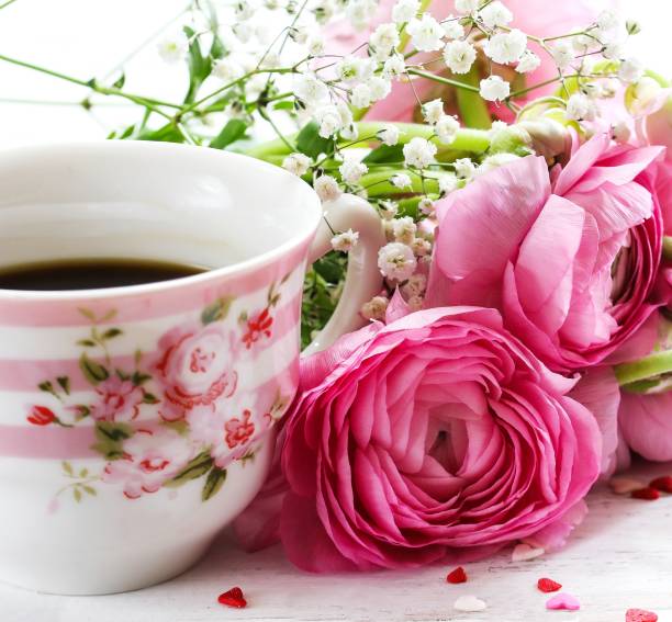 istock Cup of Coffee with pink roses / Valentines Day background, selective focus 942703424