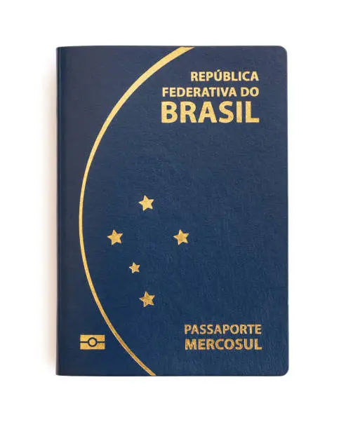 Photo of Brazilian passport on white background.