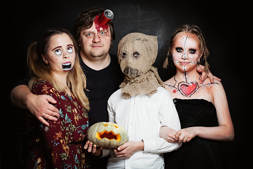 Halloween Family. Happy Father, Mother and Children Girl and Boy in Halloween Costume and Makeup