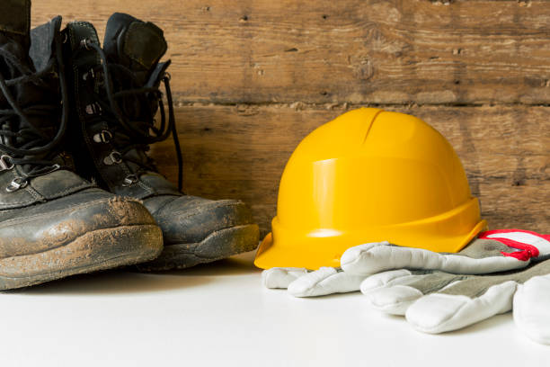 istock Equipment safety standard. Yellow hard hat, construction boots and gloves. 942706996