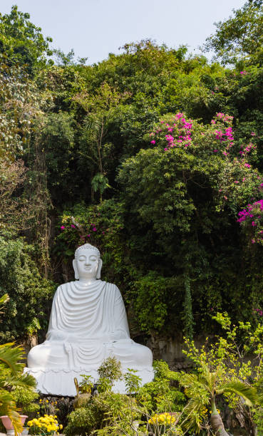 istock large white marble statue of Buddha outside 942708322