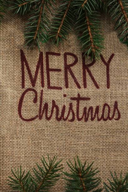 istock Merry Christmas written on Burlap fabric / Xmas Background 942709152