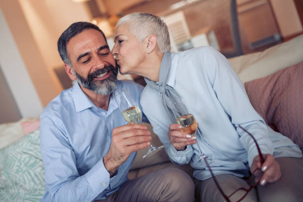 istock Mature couple toasting wine glasses 942716706