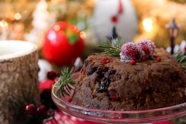 istock Homemade Xmas / Christmas pudding on festive background, selective focus 942718010