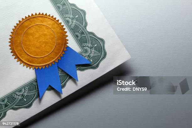 Gold Seal With Blue Ribbon On A Certificate Of Achievement Stock Photo - Download Image Now