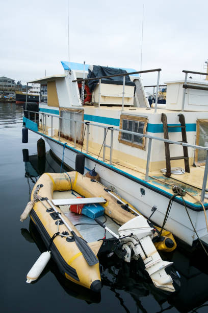 istock House boat and inflatable dingy 942724052
