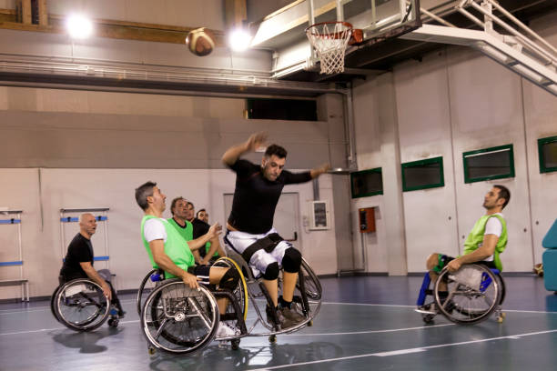 istock disabled sport men in action playing basketball 942727998