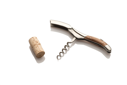 Waiter knife with corkscrew and wine cork white isolated